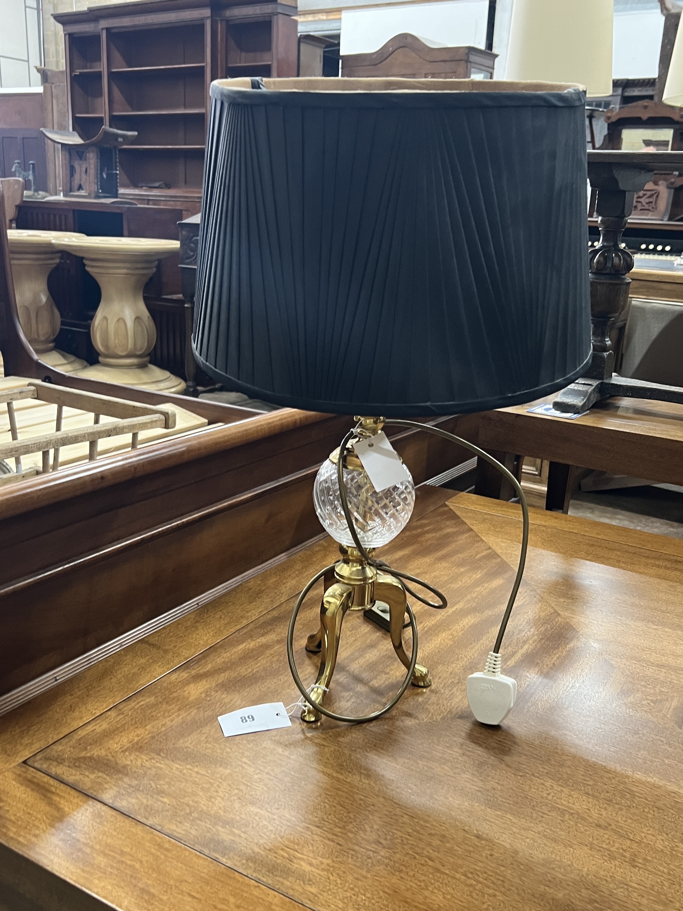 A pair of contemporary brass and clear glass tripod table lamps, height including shades 60cm